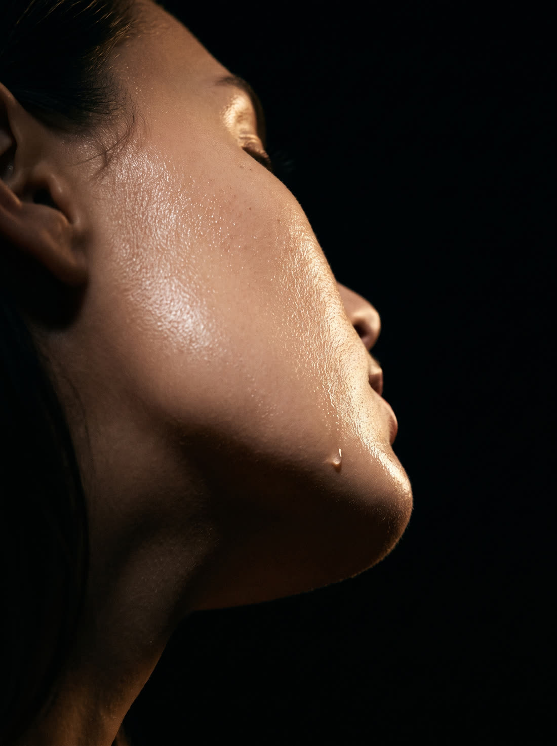 Glass-like hydrated skin along the cheekbone